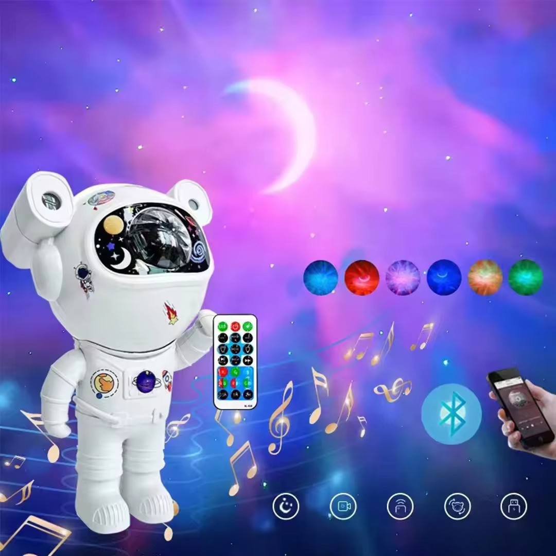 Proiector LED  in forma de astronaut cu sunete si lumini, stickere autoadezive, conexiune Bluetooth